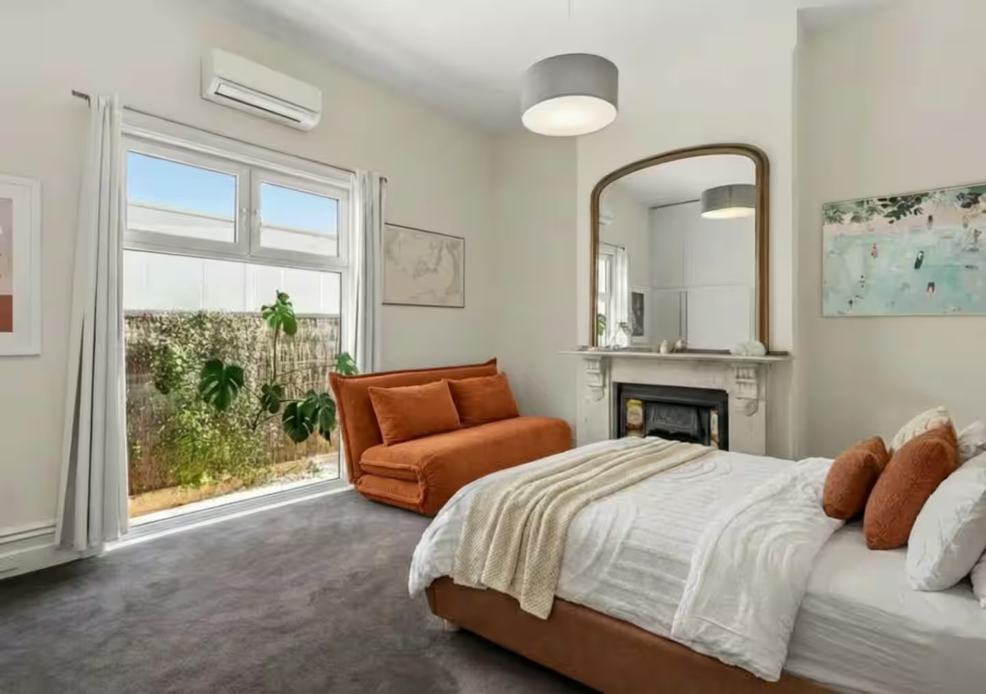 Queen bedroom with sofa bed, opening to a private courtyard