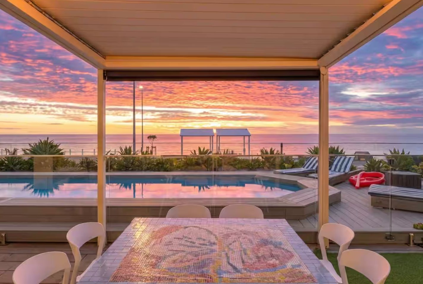 Candy-pink skies over the pool